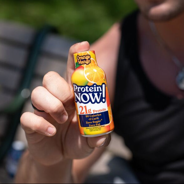 Male holding protein now shot in hand